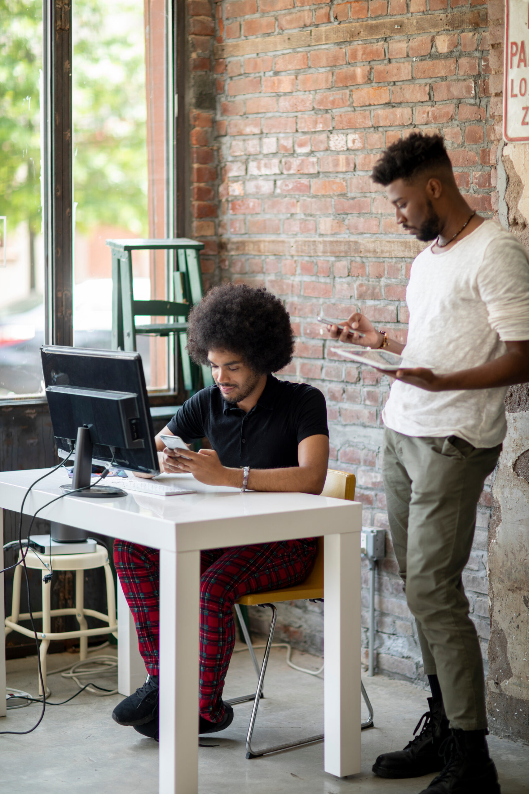 Image of two men working in an office environment.